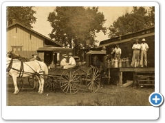 A closeup of a milk wagon at Medford's Railroad Station