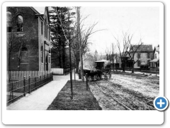 Moorestown - Main Street, Town Hall and a horse and buggy around 1910