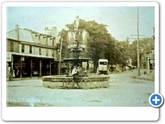 Mount Holly - A cyclist by the fountain in Mill Street