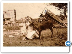 Flemington - Lois Reichert and Grandma Johnert with Calfie - !6 August 1936  - It really looks like storm damage all around them.