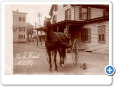 White House Station - At the CRR Depot Hotel with a trotter - Vossler's Drug Store can be seen to the left  - 1906